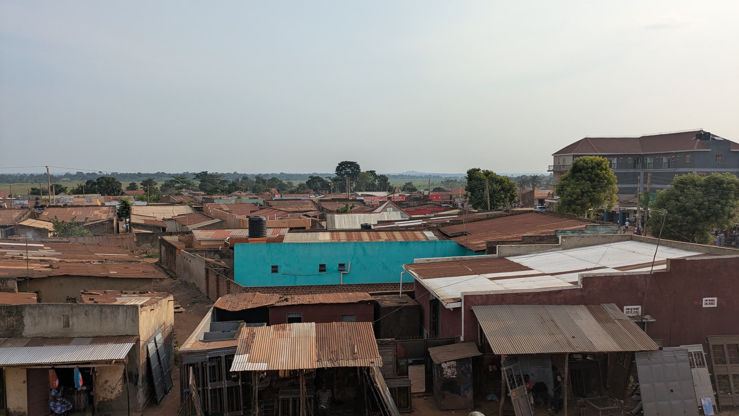 A healthcare worker smiling with a community member.