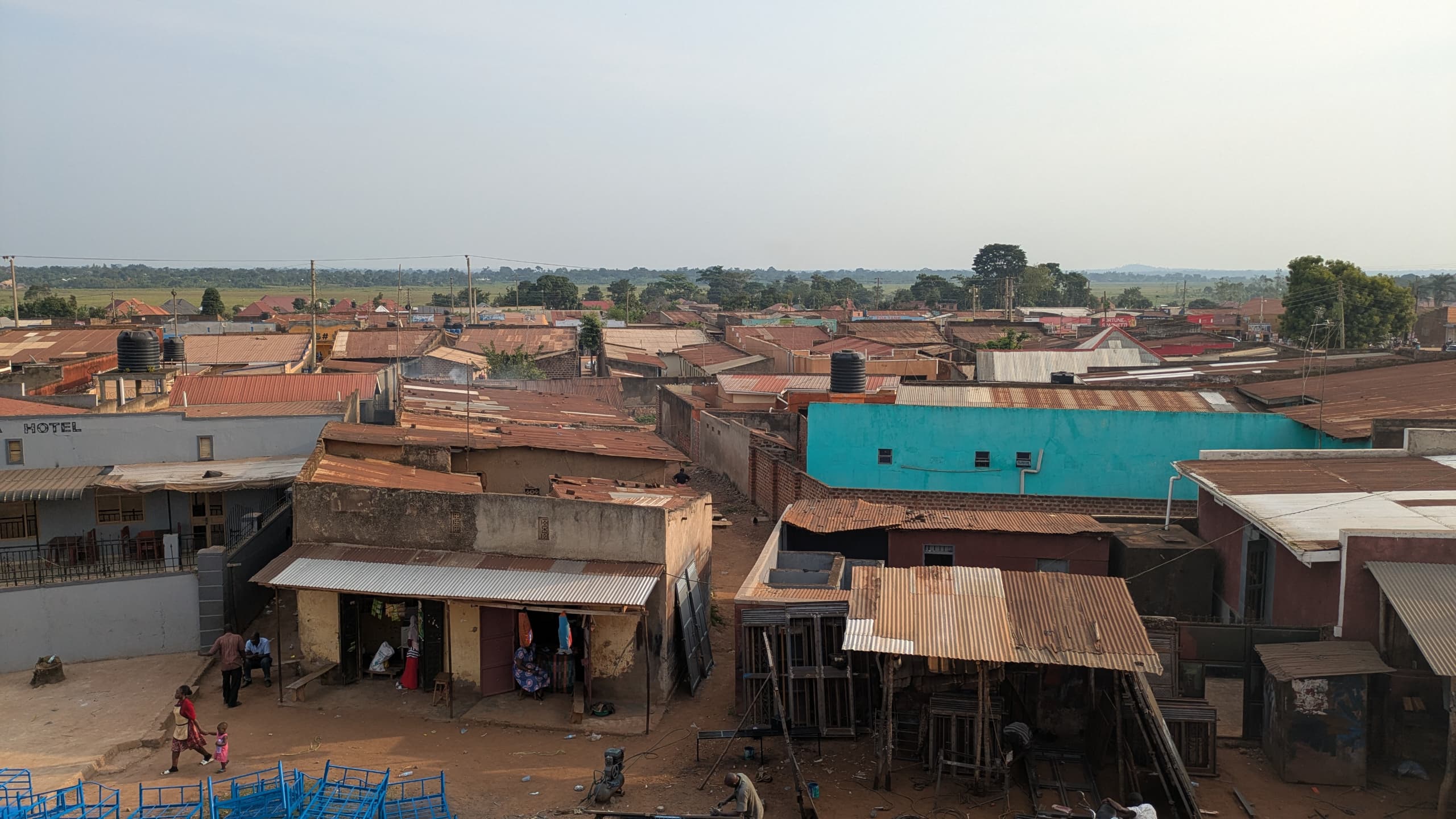 A healthcare worker smiling with a community member.